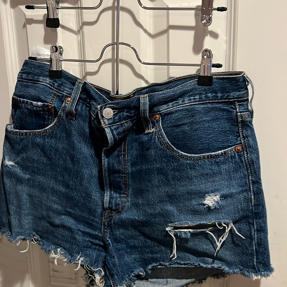 Levi’s 501 blue wash ripped jean shorts
